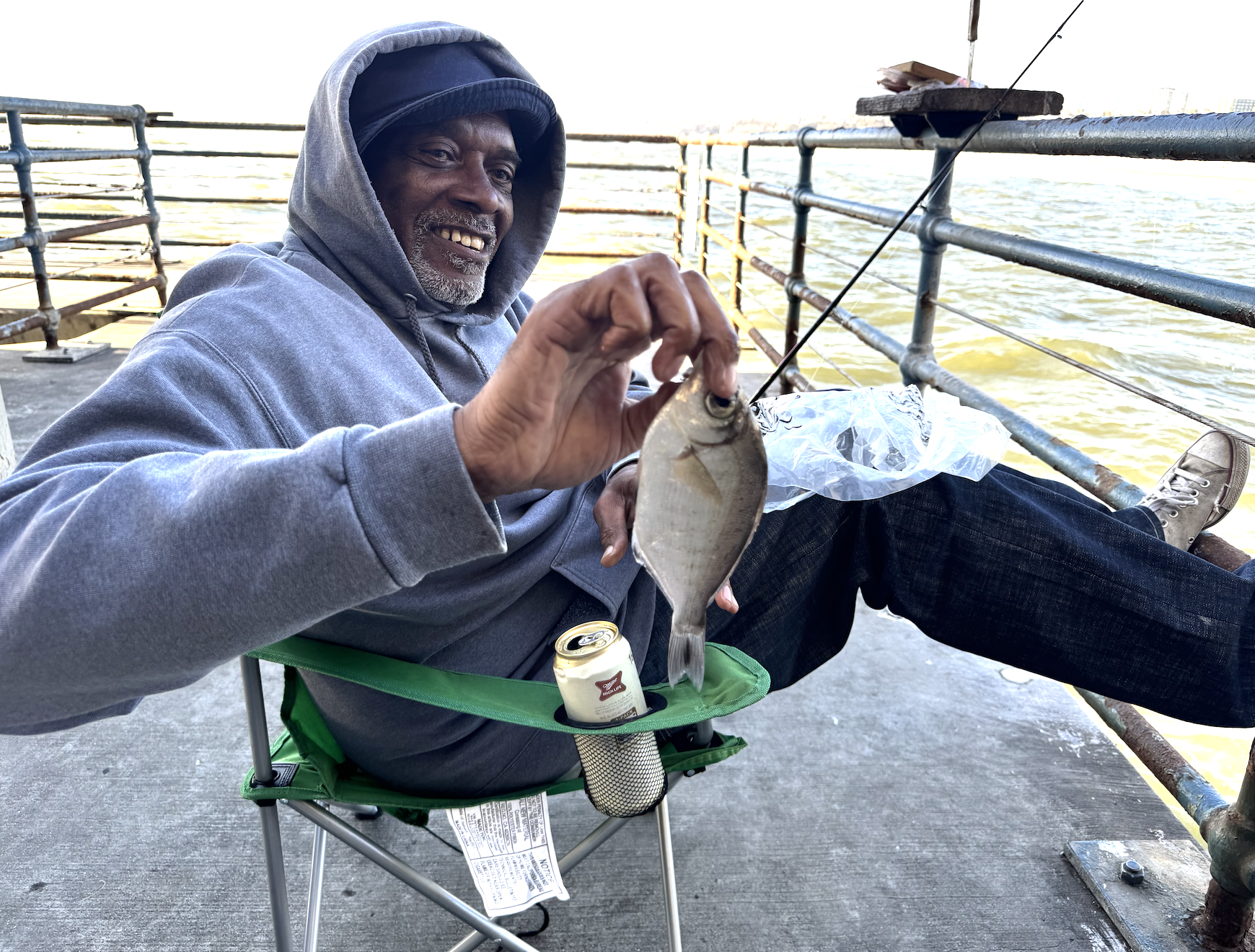 greg with his fish and a miller high life